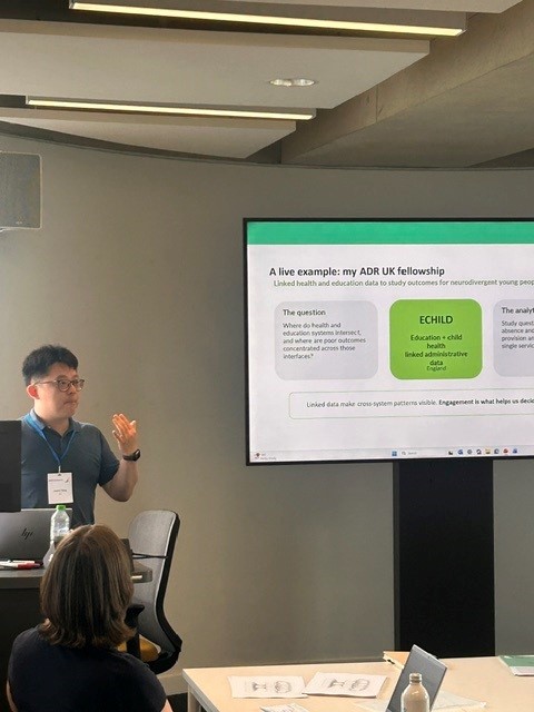 Justin Yang presents at the conference